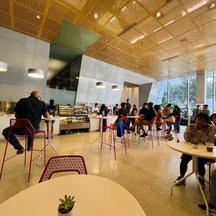 people sitting at tables and eating