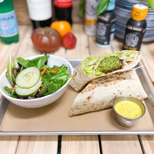 Giza Wrap.

House made Falafel, green hummus, turmeric-tahini dressing and lavash bread wrap.