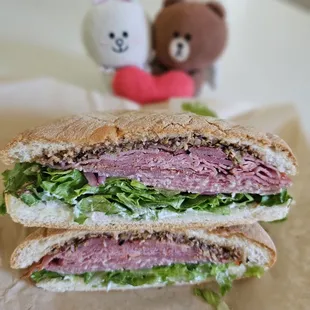 FONZ: Fresh prosciutto, Pastrami, salami, house olive tapenade, Maui butter lettuce, pickled red onion, and house mayo... yum!!!