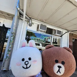 Storefront... blocking the people sitting on the bench in front of the shop