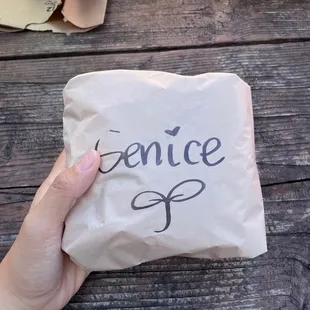 a person holding a piece of paper with the word once written on it