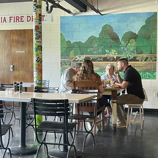 a group of people sitting at a table