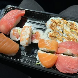 $14.49 sushi combination (It was arranged very neatly at first but I tilted the platter on accident and messed it up lol)