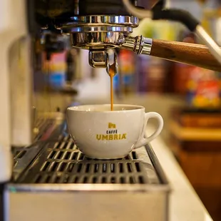 coffee being poured into a cup