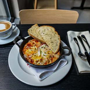 a plate of food and a cup of coffee