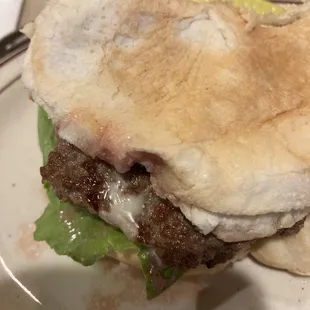 Cheap thin bun, tasteless hamburger But good toppings