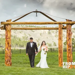 Jessica being escorted by her father photography by From The Hip Photo @SpruceMountainRanch