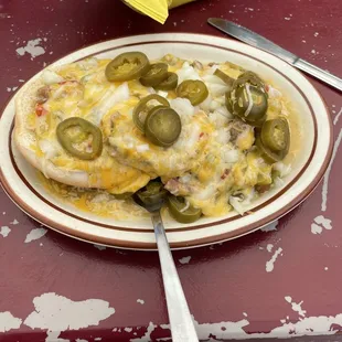green chile burger with cheese, onions and jalapeno.