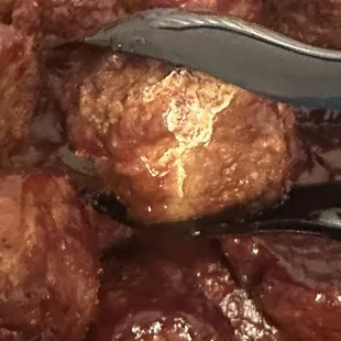 No idea what this is on this meat ball it was crusted and white
