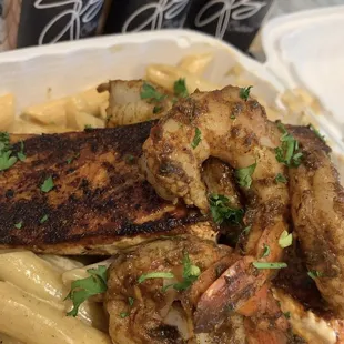 Blackened salmon and shrimp over pasta