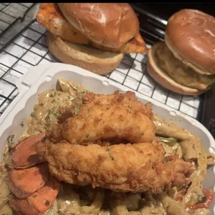 Fried lobster tail over Rasta Pasta