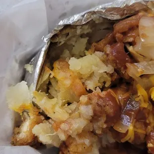 The small scoop of butter covering less than 1/4 of potatoe