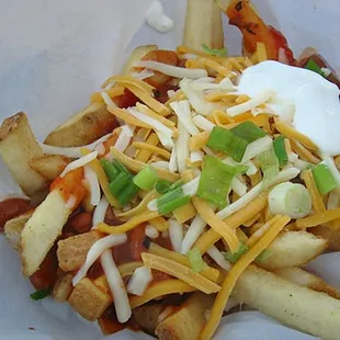 Chili Cheese Fries - Texas Tri-Tip Chili, Cheddar Cheese , Green Onion , and Sour Cream