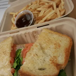Pesto chicken sando with fries.