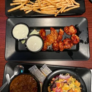 Short rib sliders, boneless wings, chili and salad.