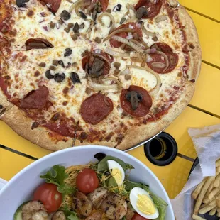 Deluxe pizza, house salad with shrimp, &amp; shoestring fries