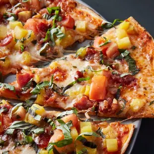 a pizza with a slice taken out of it