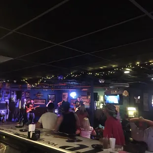 a group of people sitting at a bar