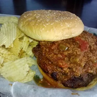 Spykes Tee Pee Burger with Chips- Homemade burger topped chili, onions, jalapenos, and cheese.