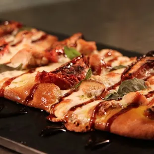CHICKEN CAPRESE Herb roasted tomatoes, fresh mozzarella, basil, balsamic reduction