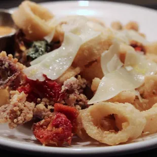 CALAMARI Sundried tomatoes, basil, garlic, parmesan, lemon, bistro sauce
