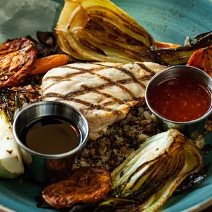 SQUARE BOWL CHICKEN Ancient grains, bok choy, carrots, herb roasted tomatoes, wild mushrooms, ponzu and sweet chili sauce
