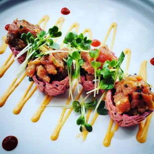 a plate of appetizers on a white plate