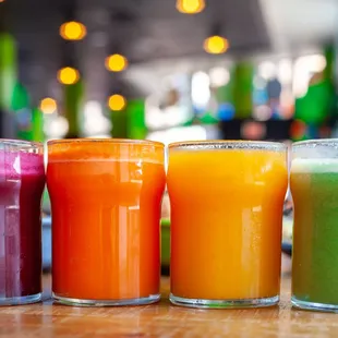 a row of colorful juices