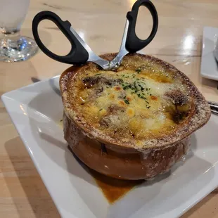 French Onion Soup. The scissors are a touch I've never encountered before!