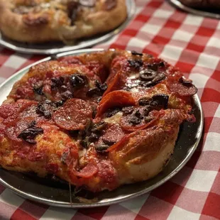 Red Pizza with Pepperoni and Olives