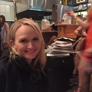 a woman sitting at a table in a restaurant