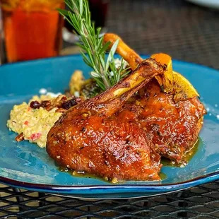 Crispy Roasted Duck à l&apos;orange (Grand Marnier Orange Glaze, Lemon-Bacon-Goat Cheese Brussel Sprouts, Pecan-Dried Cranberry Grits)