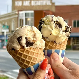 two cones of ice cream with chocolate chips