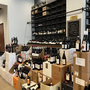 rows of wine bottles and boxes