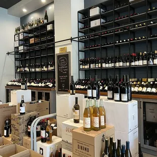 rows of bottles of wine on shelves