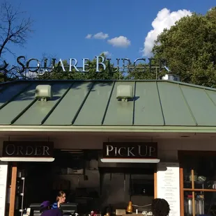 people standing in front of a restaurant