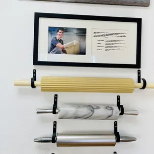 a rolling pin with a picture of a man holding a rolling pin