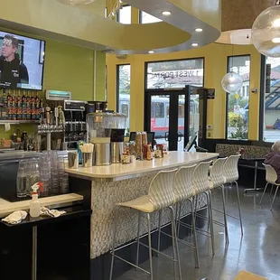 people sitting at tables in a restaurant