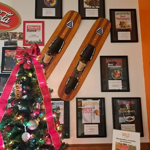 Wall of Squeeze Burger magazine covers and awards