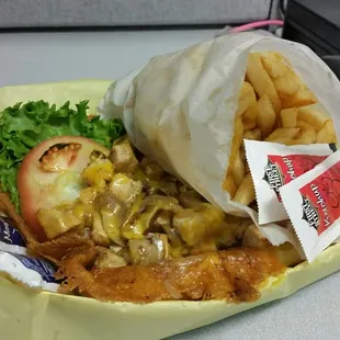 Grilled chicken sandwich and fries.  Cheesy goodness!