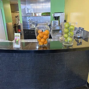 oranges and limes on the counter