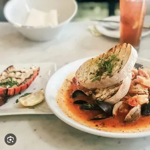 a plate of seafood and bread