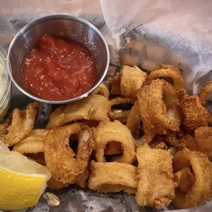 Small order of calamari rings with cocktail sauce and tartar sauce