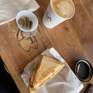 Turkey &amp; Swiss grilled toastie with cornichons and an oatmilk latte