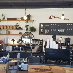 Interior. Calm, efficient barista works through a flurry of drink orders (7/18/21)