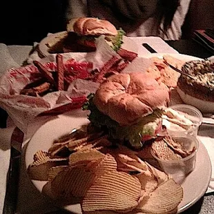 a plate of sandwiches and chips