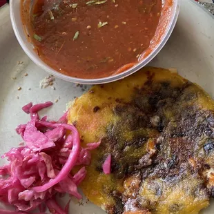 Vegetarian black bean and cheese pupusa with fresh salsa and curtido from Cafe Agnes.