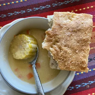 Vegan corn soup with mushrooms and carrots and coconut bread from Shado Beni