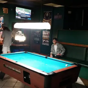 a pool table in the foreground