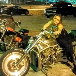 a woman sitting on a motorcycle